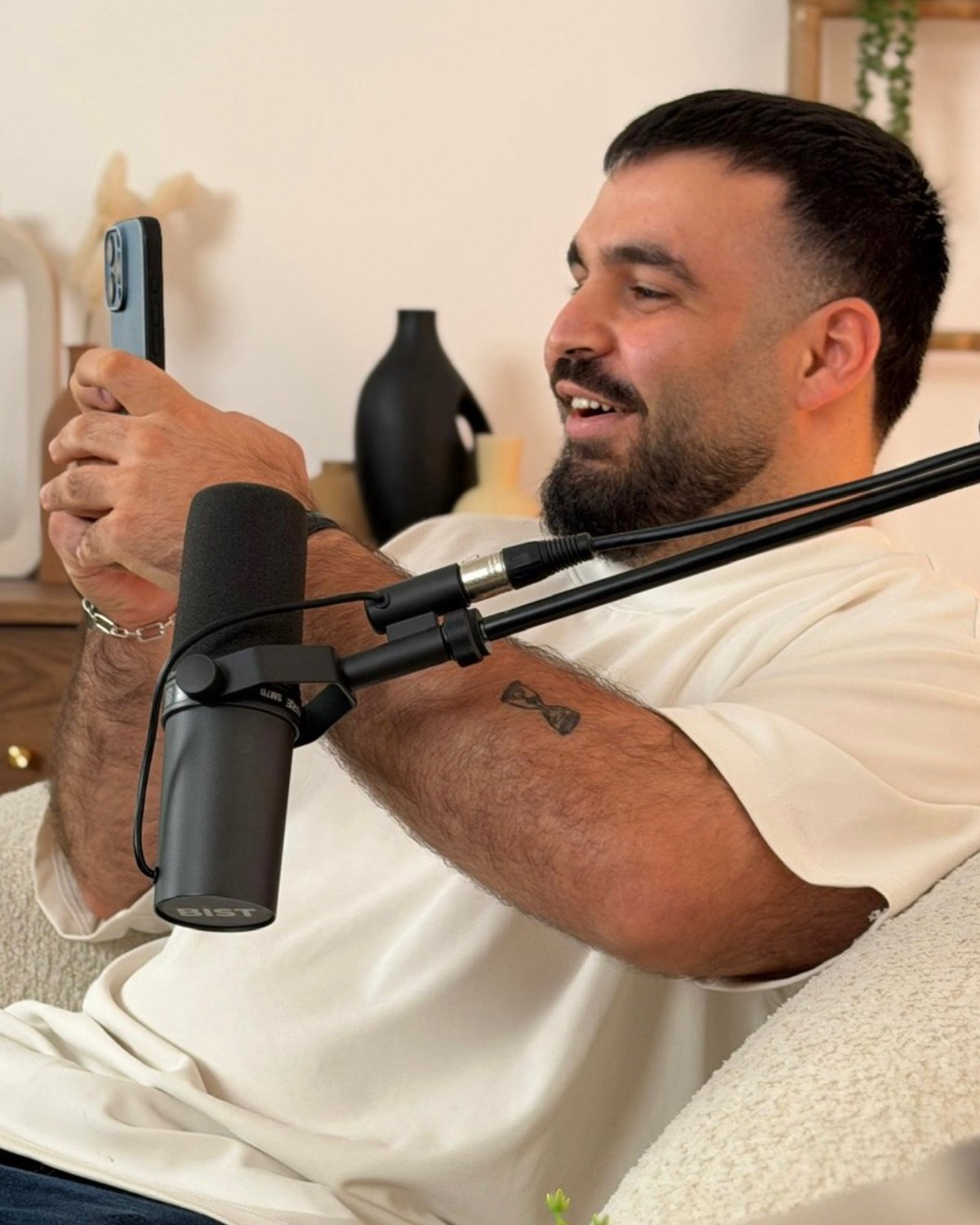 Roni recording the Bli Masechot podcast